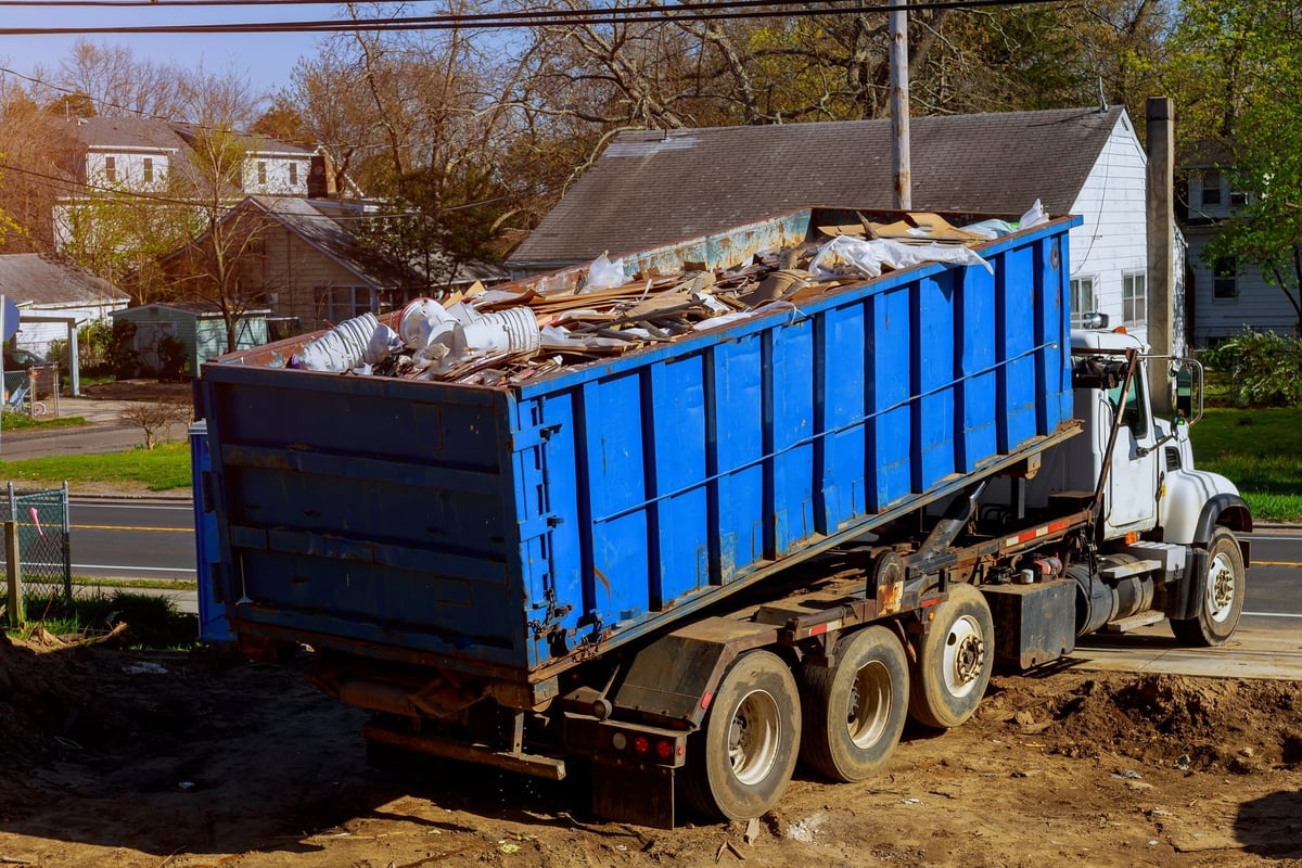 Dumpster loaded and cleared of junk